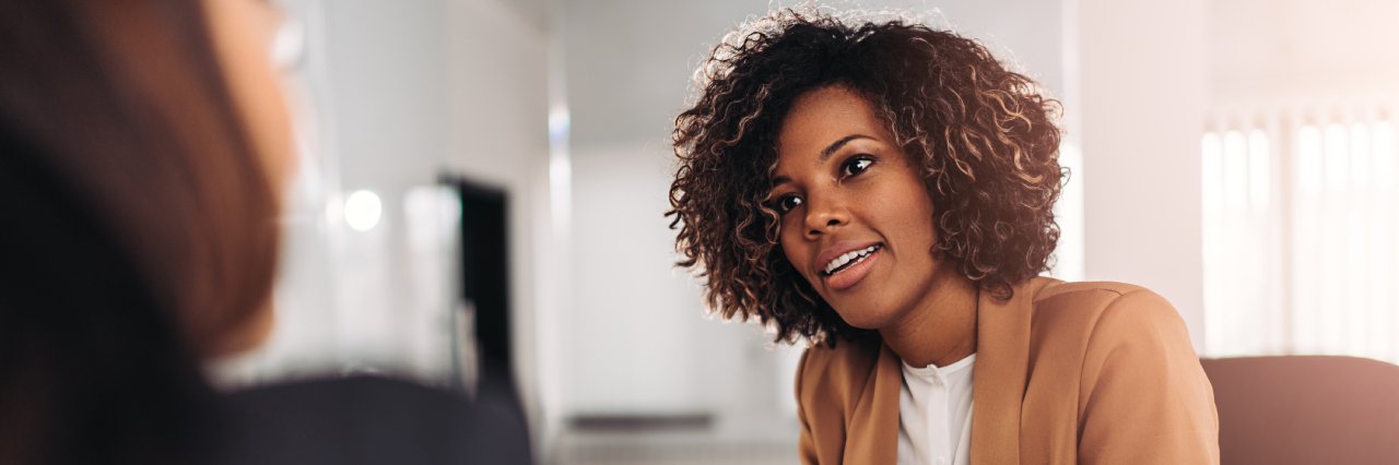 a woman discussing with someone about payment terms