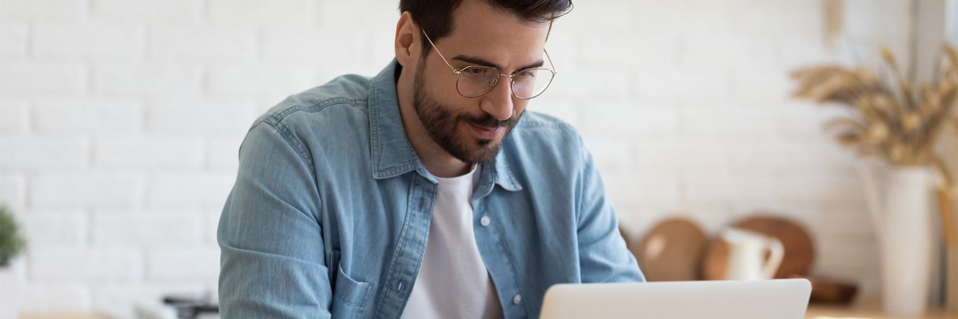 a man using laptop about cash flow forecast