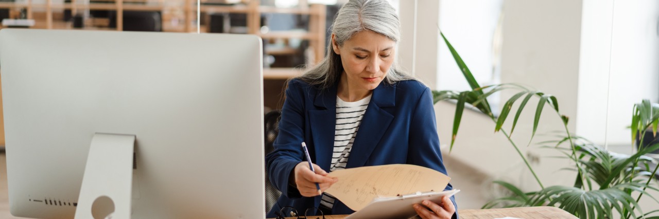 woman working next to the monitor