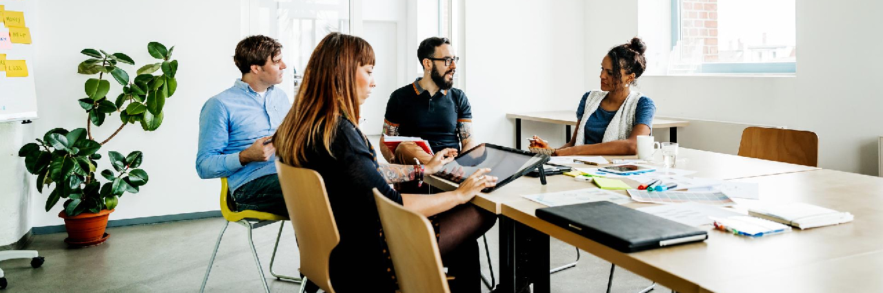 four-people-meeting-in-office