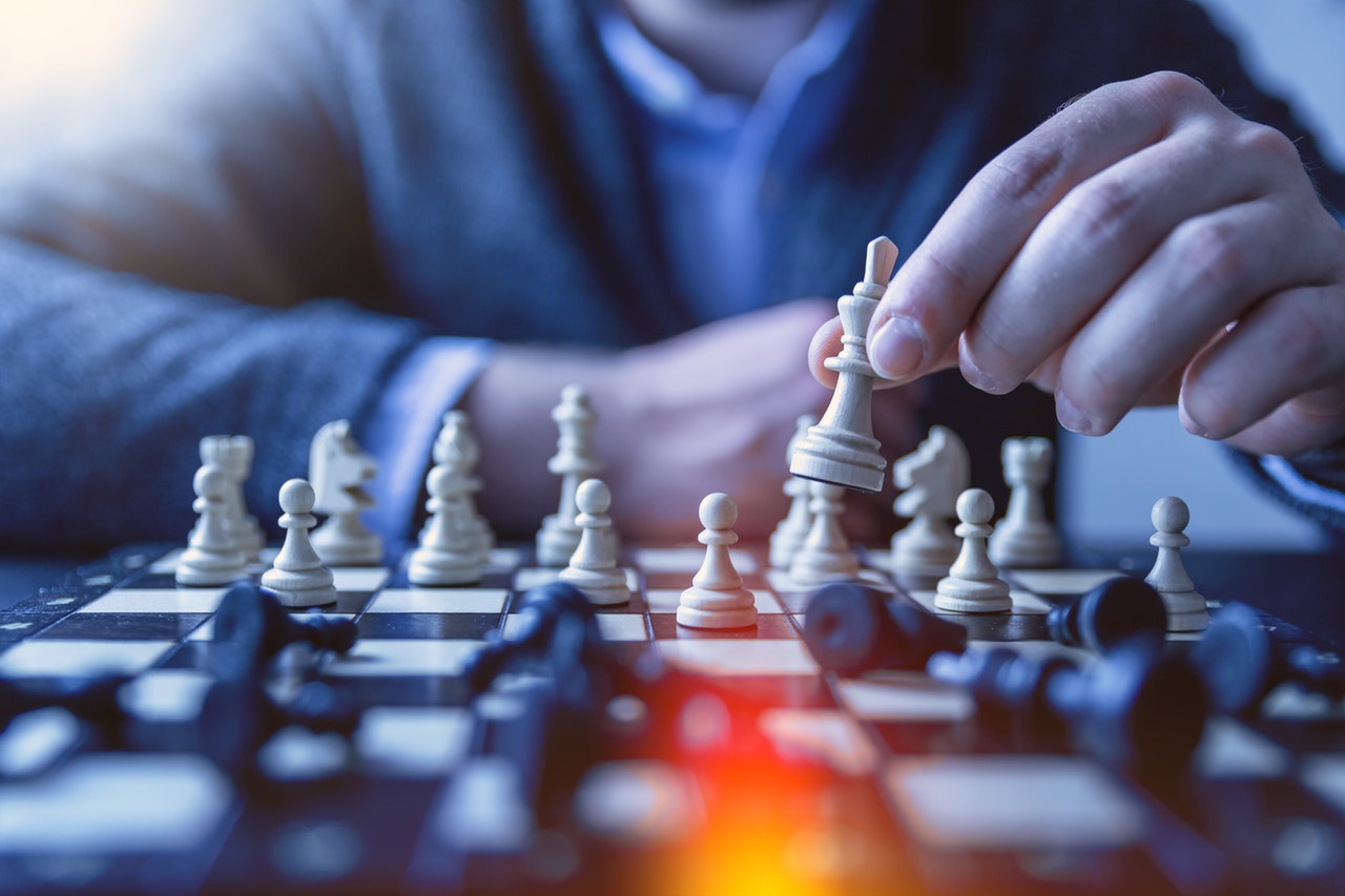 A person is playing chess