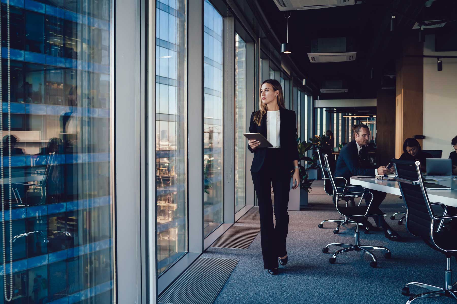 modern office setting with multiple employees