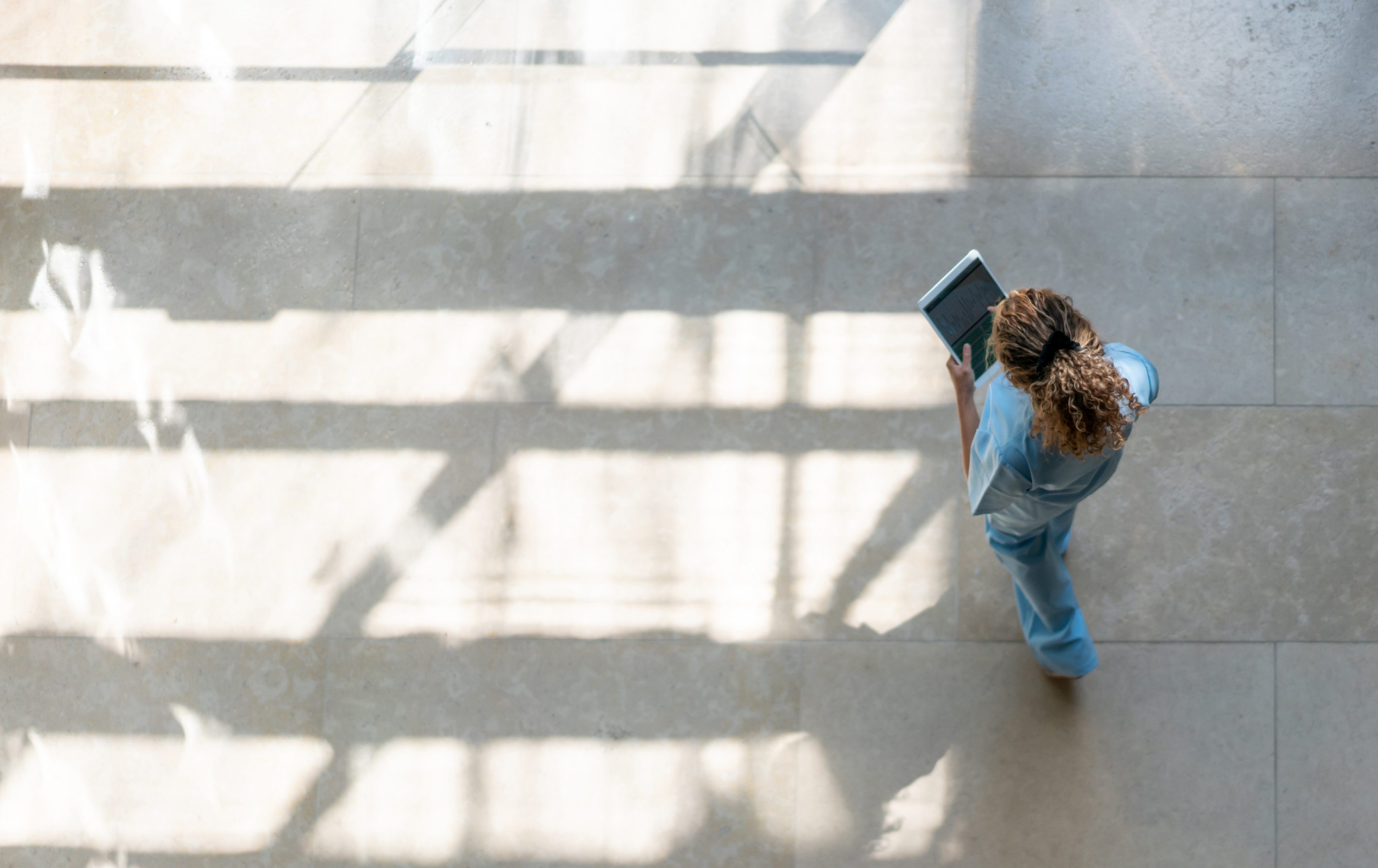 overhead view of woman on tablet
