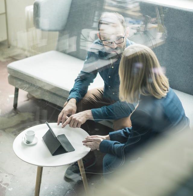 People discussing business on a couch