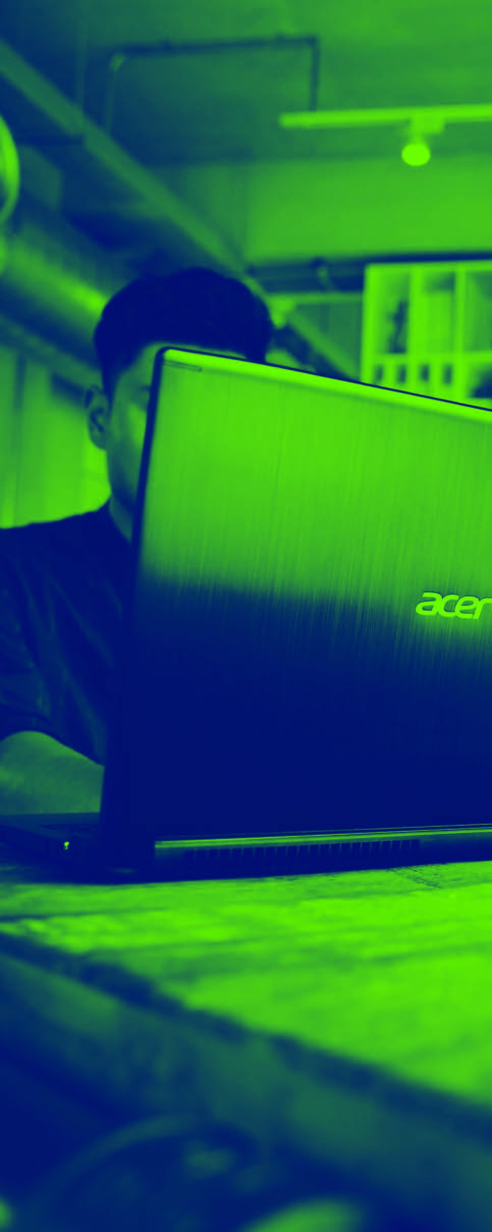 User Checks Trade Risks on Acer Laptop - Vertical Banner